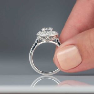closeup of woman holding diamond engagement ring 9slbpju.jpg